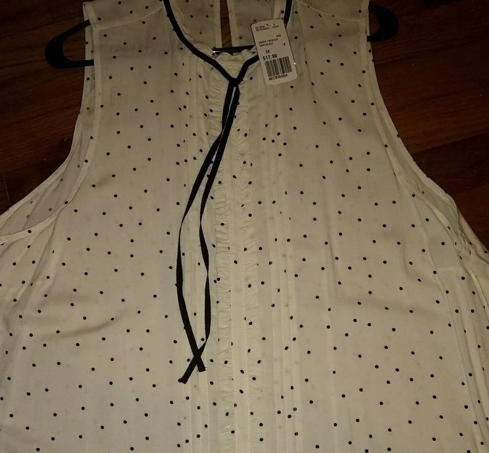 Black and ivory polka dot sleeveless top.